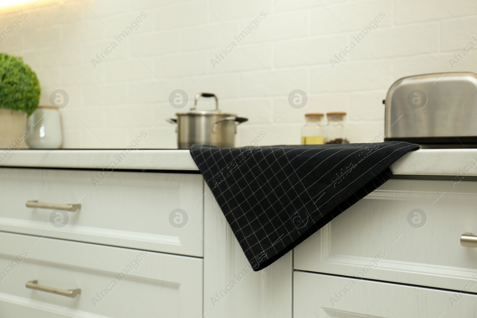 Photo of Cotton towel on countertop in modern kitchen