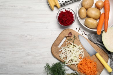 Photo of Fresh borscht ingredients on white wooden table, flat lay. Space for text