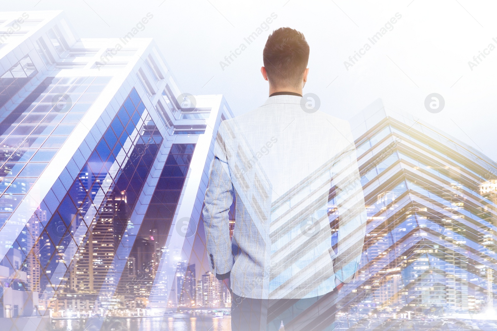 Image of Double exposure of businessman and different buildings in city