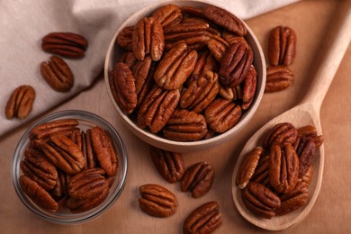 Photo of Flat lay composition with tasty pecan nuts on wooden table