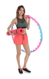 Photo of Beautiful woman with yoga mat and hula hoop on white background