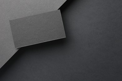 Photo of Blank business card on black background, top view. Mockup for design