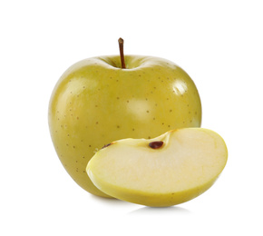 Cut and whole yellow apples on white background