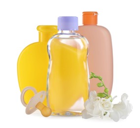 Photo of Baby oil, toiletries, pacifier and flowers on white background
