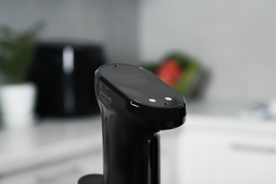 Photo of Thermal immersion circulator in kitchen, closeup. Sous vide cooking
