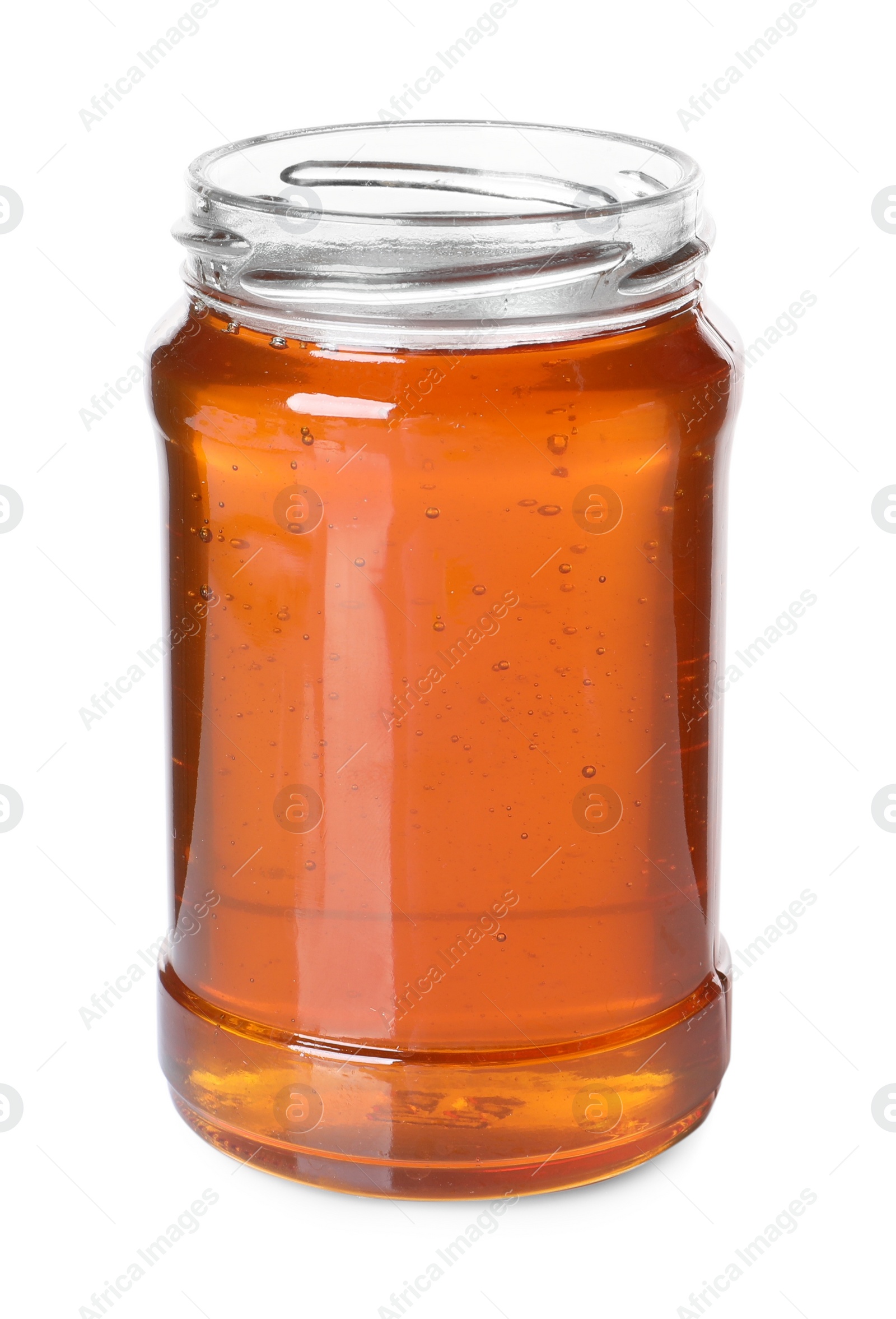 Photo of Tasty natural honey in glass jar isolated on white