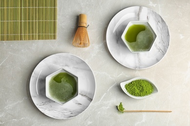 Photo of Flat lay composition with matcha tea on table