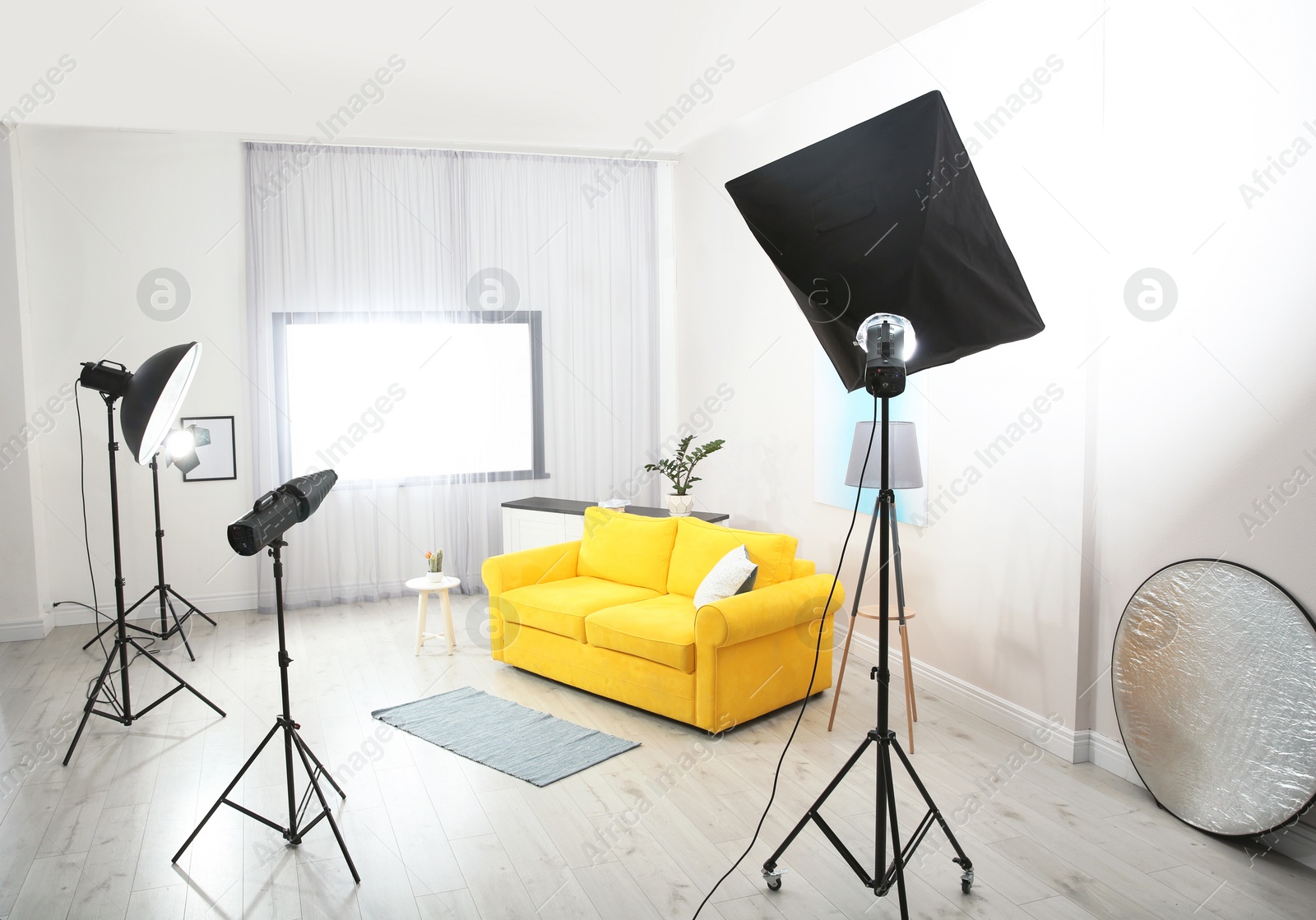 Photo of Example of living room interior design and professional equipment in photo studio