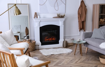 Photo of Beautiful living room interior with fireplace and armchairs