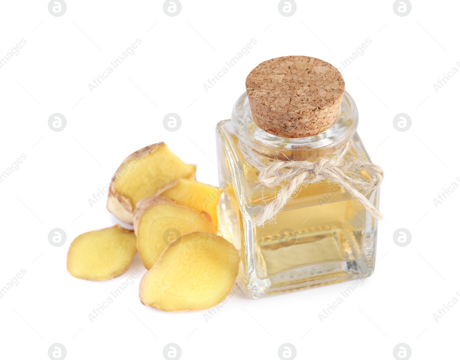 Photo of Glass bottle of essential oil and ginger root on white background