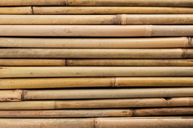 Photo of Dry bamboo sticks as background, top view