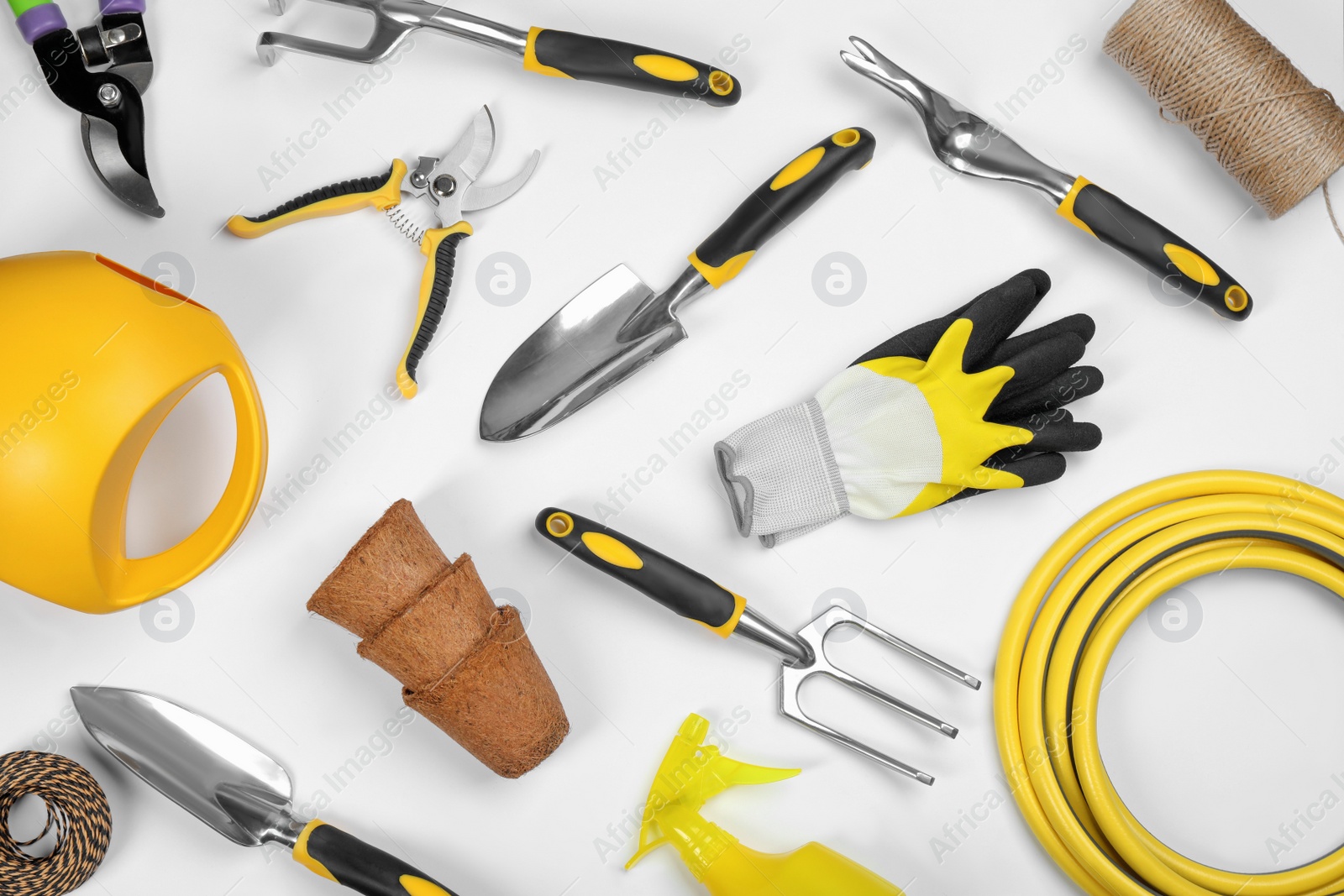 Photo of Flat lay composition with gardening tools on white background