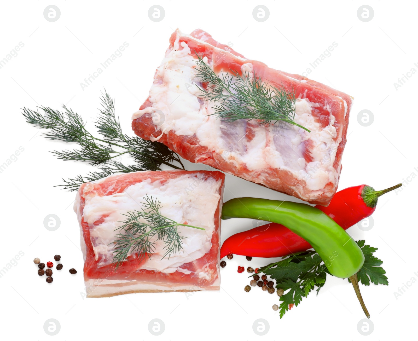 Photo of Pieces of pork fatback and different spices on white background, top view