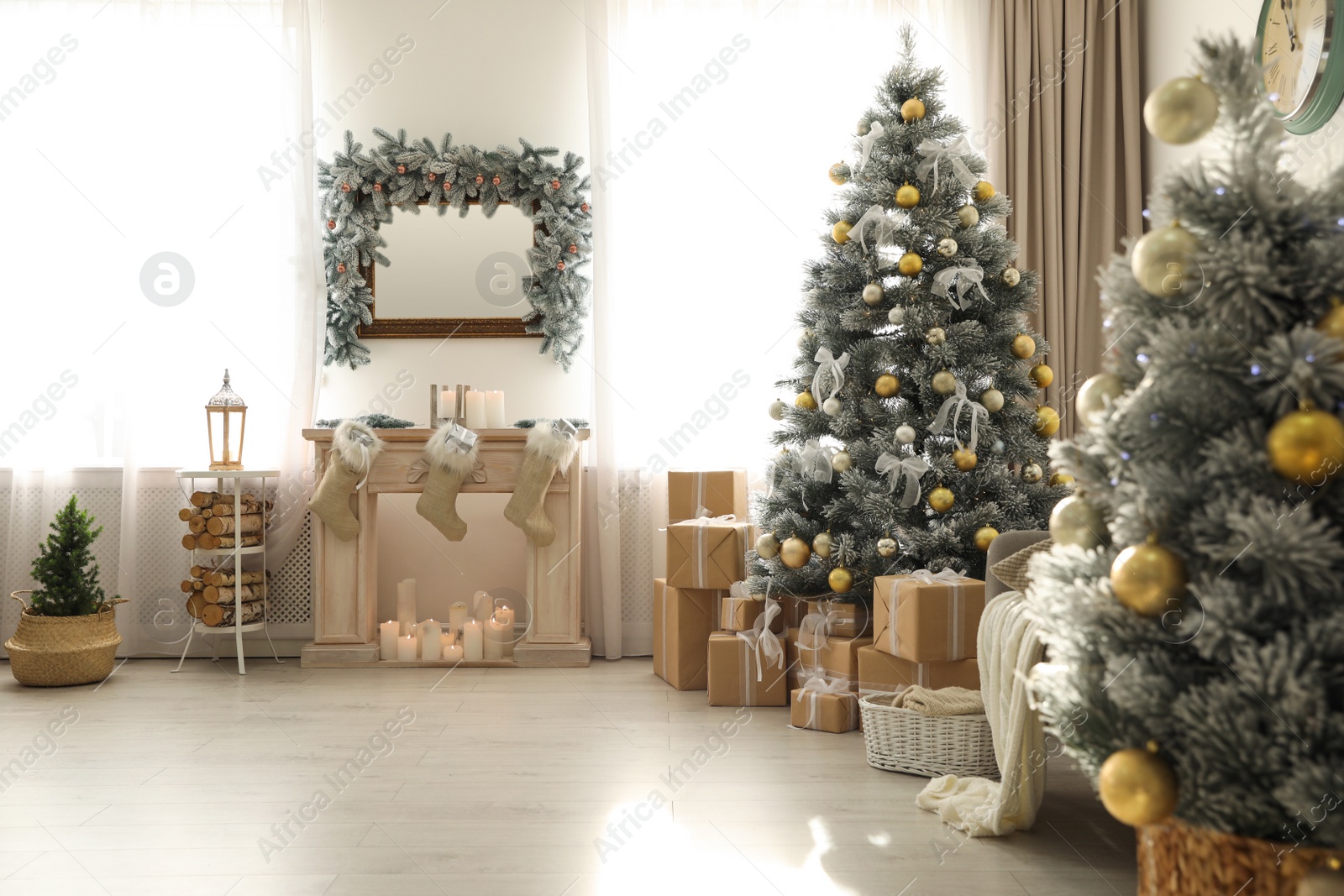 Photo of Stylish Christmas interior with beautiful decorated tree and fireplace