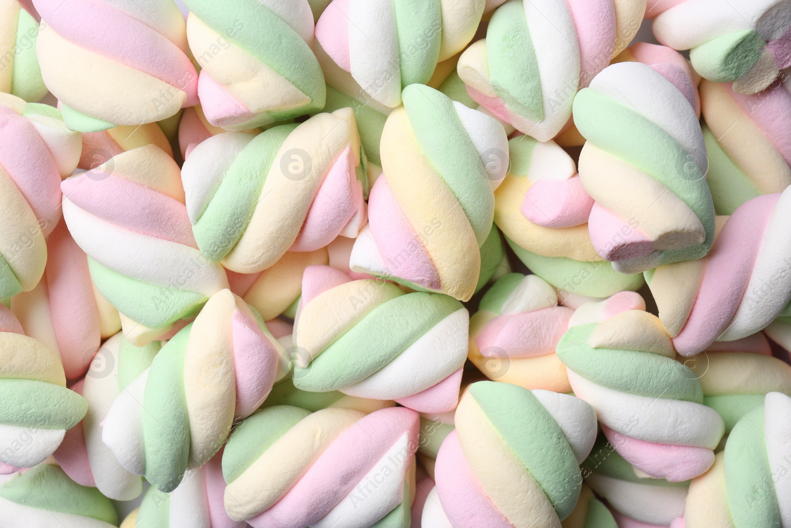 Photo of Delicious colorful marshmallows as background, top view