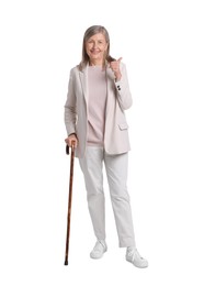 Photo of Senior woman with walking cane showing thumb up on white background