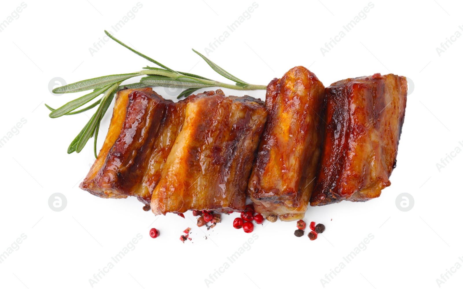 Photo of Tasty roasted pork ribs, rosemary and peppercorns isolated on white, top view