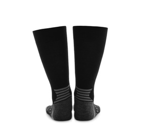 Woman wearing thermal socks on white background, closeup of legs. Winter sport clothes