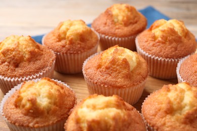 Photo of Delicious sweet muffins on table, closeup view