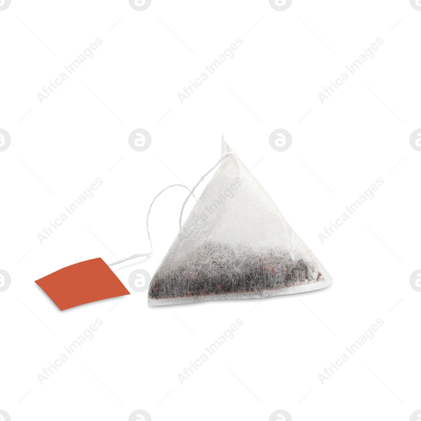 Photo of New pyramid tea bag isolated on white