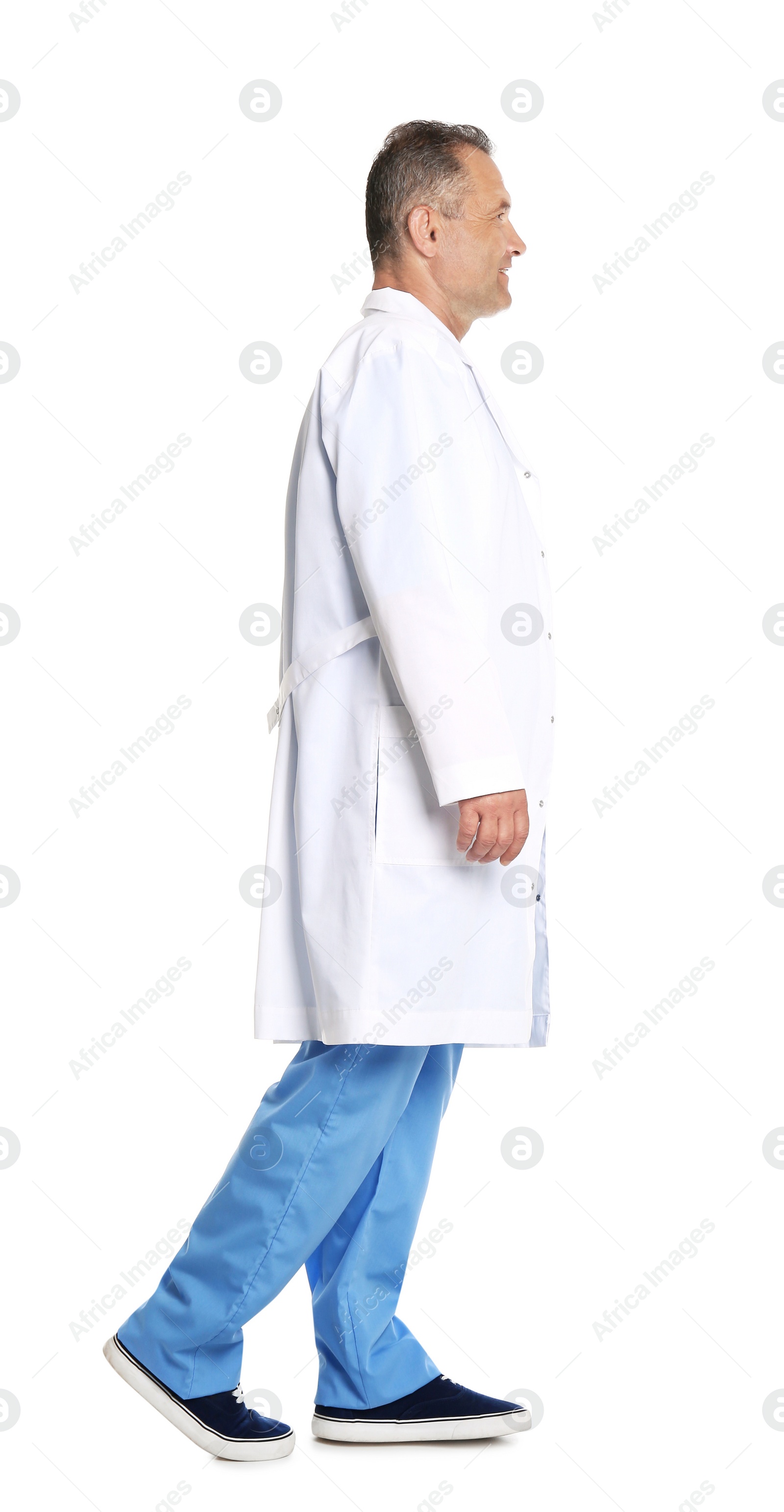 Photo of Full length portrait of experienced doctor in uniform on white background. Medical service