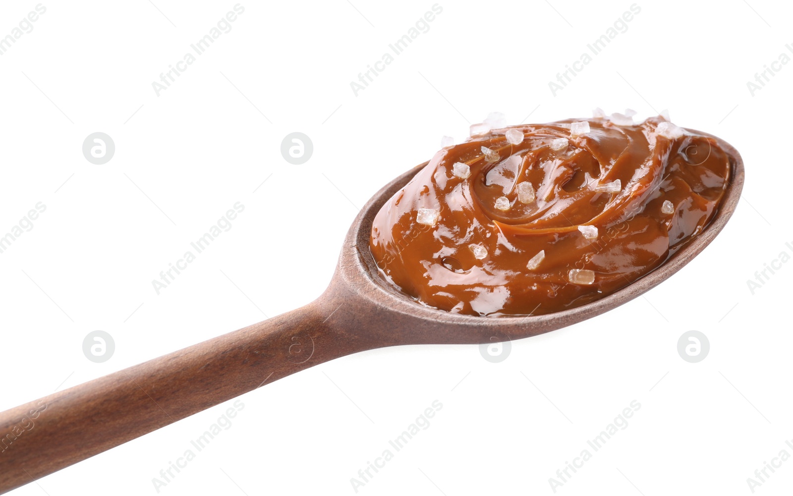 Photo of Salted caramel in spoon isolated on white