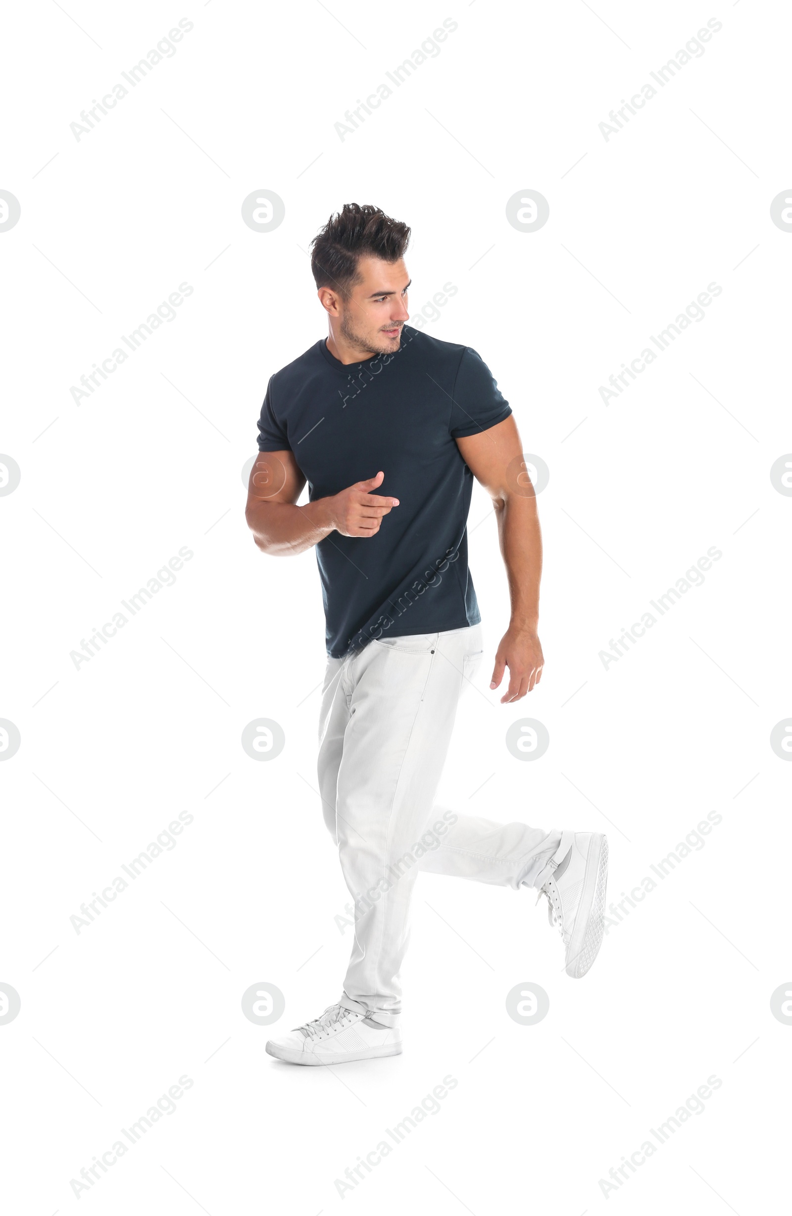 Photo of Young man in stylish jeans on white background