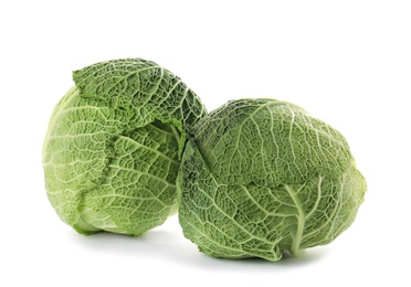 Photo of Fresh green savoy cabbages on white background