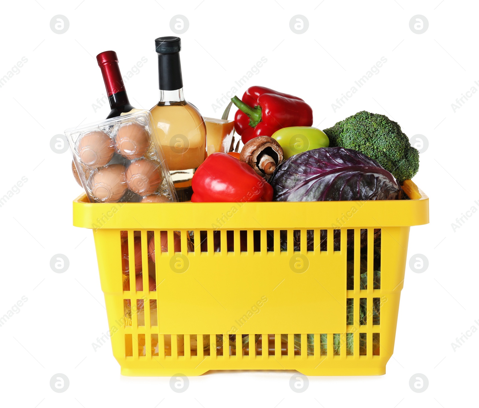 Photo of Shopping basket with grocery products on white background