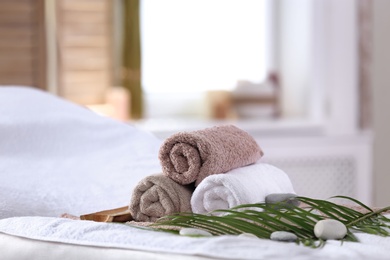 Photo of Beautiful spa composition on massage table in wellness center