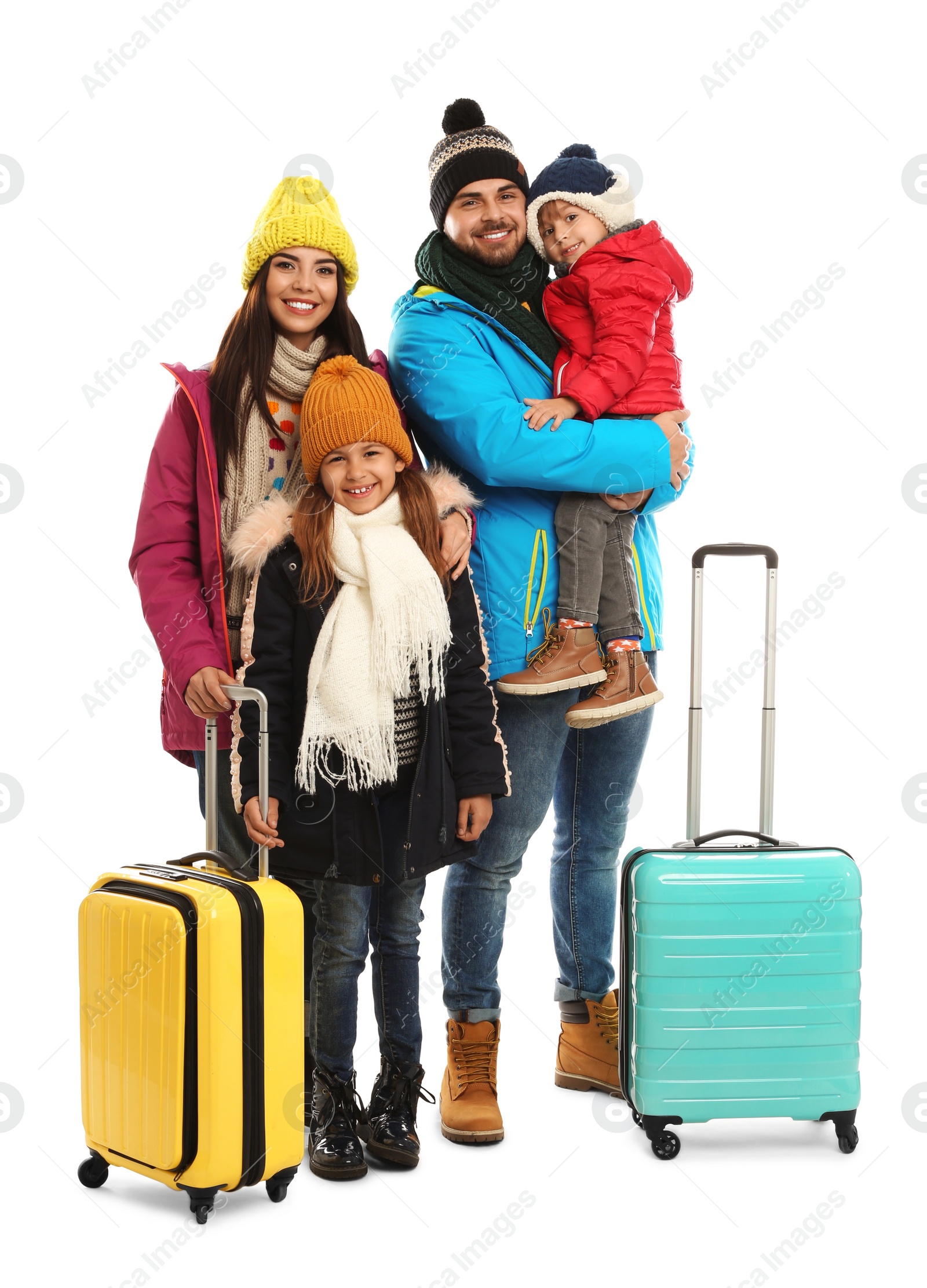 Photo of Happy family in warm clothes with suitcases on white background. Winter vacation