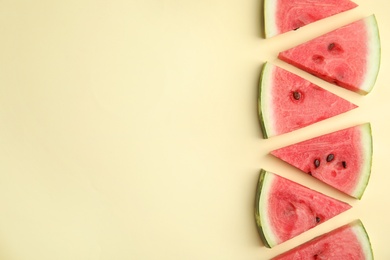 Photo of Slices of ripe watermelon on beige background, flat lay. Space for text