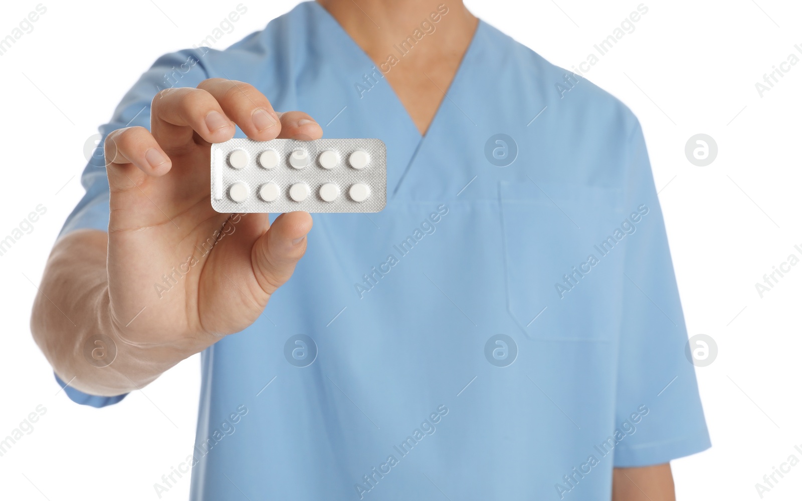 Photo of Male doctor holding pills on white background, closeup. Medical object