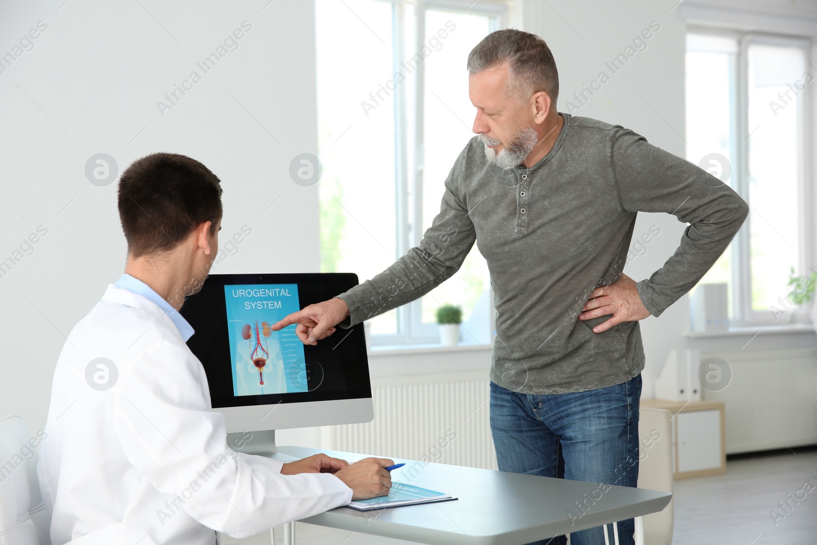 Photo of Man with health problem visiting urologist at hospital