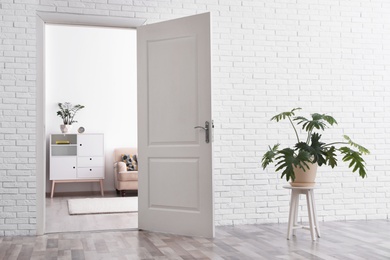 Room interior with new furniture, view through open door