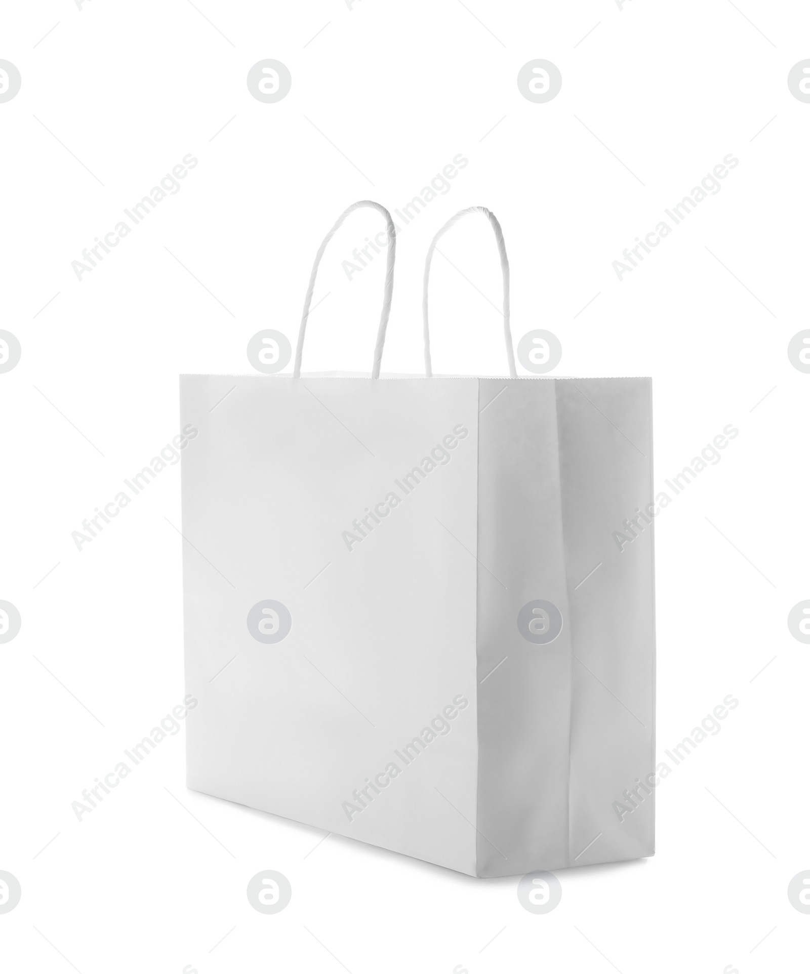 Photo of Mockup of paper shopping bag on white background