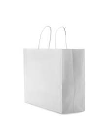 Photo of Mockup of paper shopping bag on white background