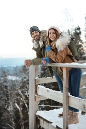 Couple spending winter vacation together in mountains