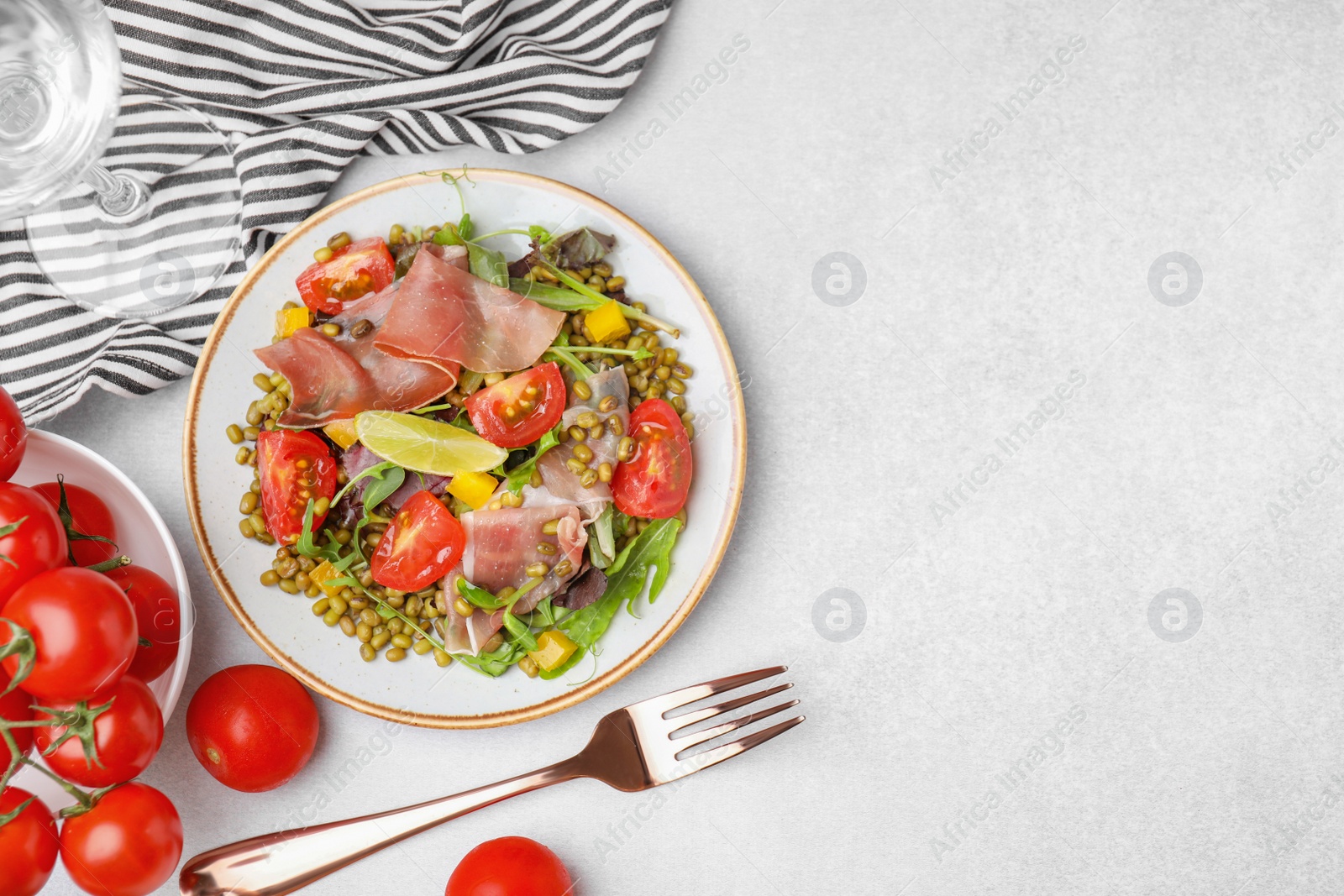 Photo of Plate of salad with mung beans on white table, flat lay. Space for text