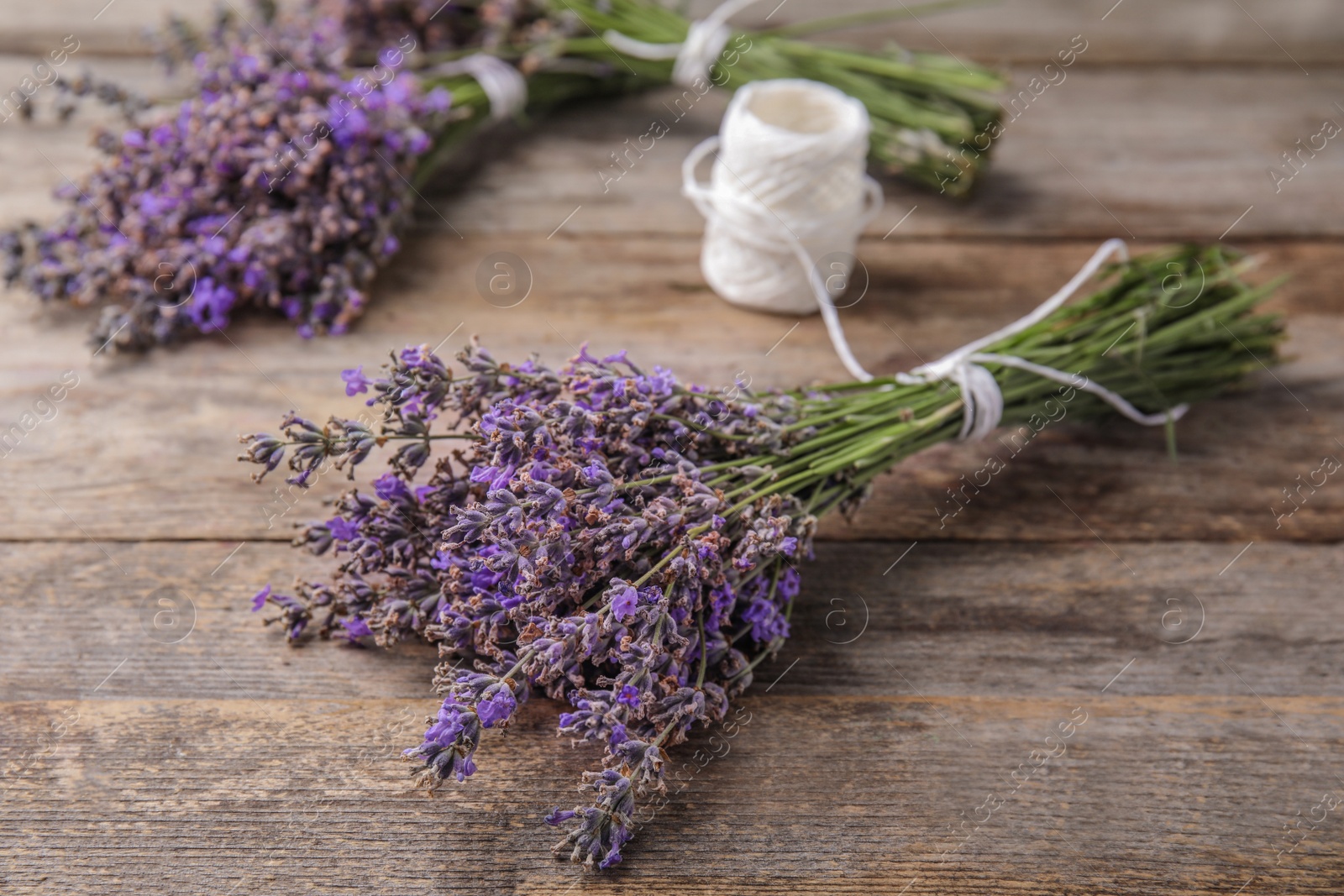 Photo of Composition with lavender flowers on wooden background