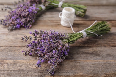 Photo of Composition with lavender flowers on wooden background