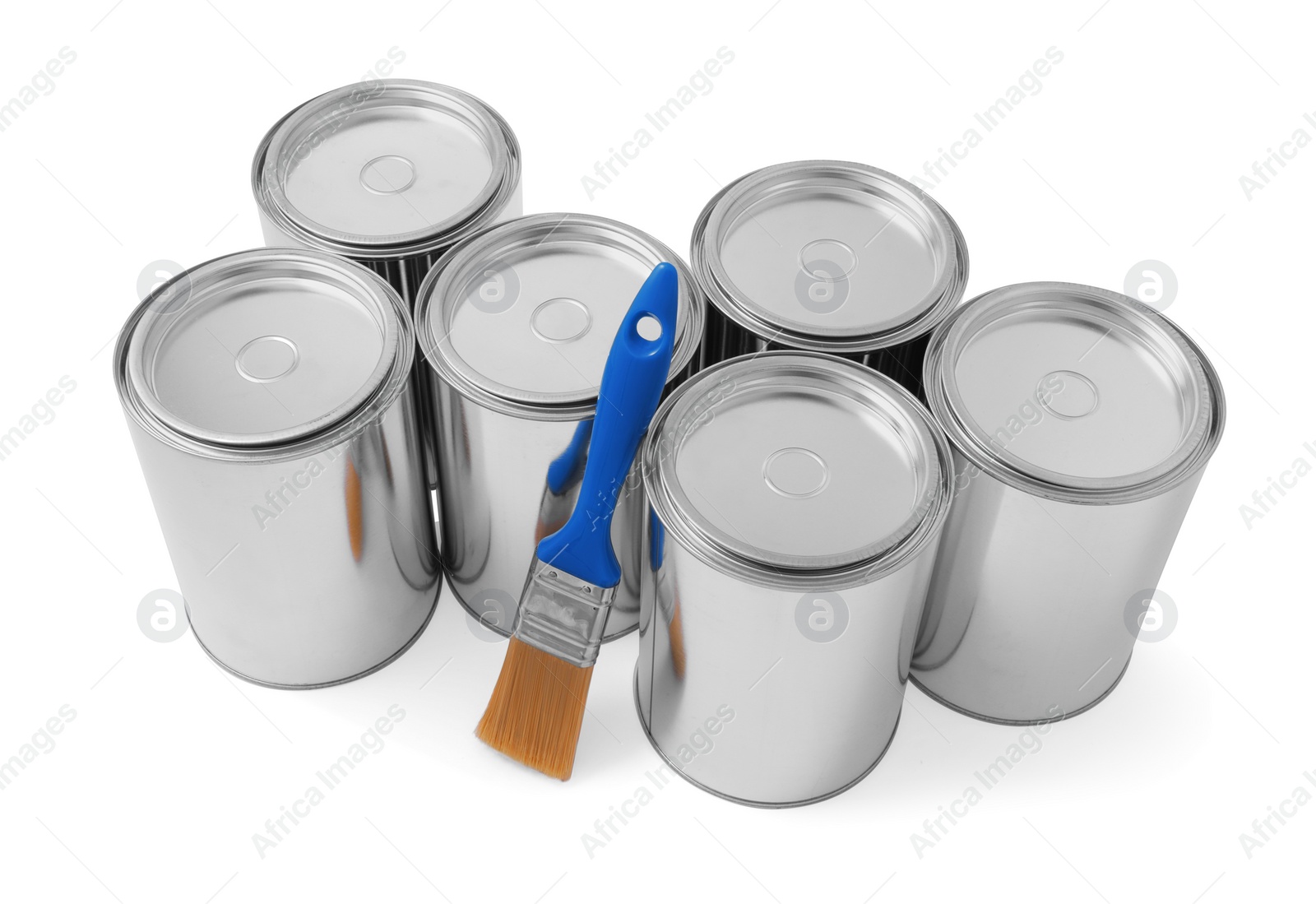 Photo of Cans of paints and brush on white background