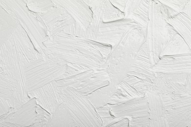 Texture of white oil paint as background, closeup