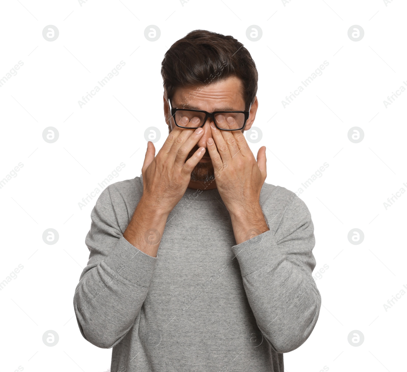 Photo of Man suffering from eyestrain on white background