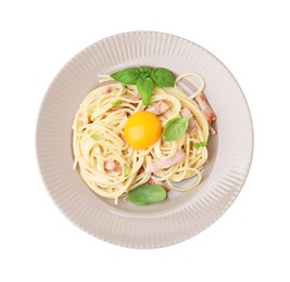 Photo of Plate of delicious pasta Carbonara with egg yolk isolated on white, top view