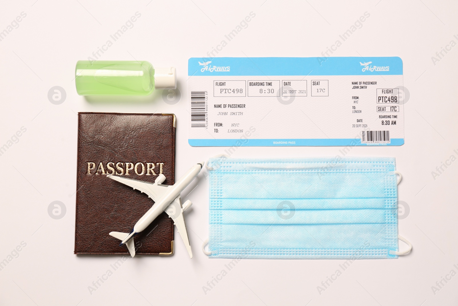 Photo of Composition with passport and protective mask on white background, top view. Travel during quarantine