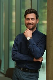 Photo of Portrait of handsome stylish man in office