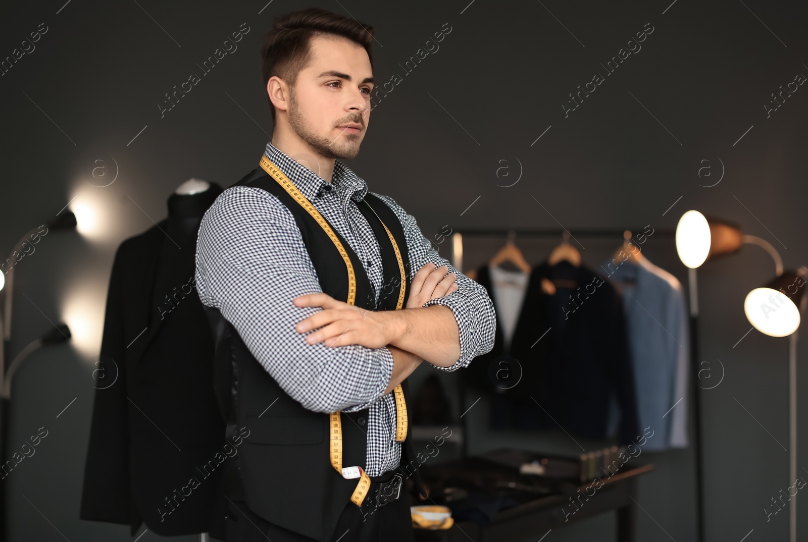 Photo of Portrait of young tailor in atelier