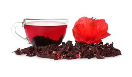 Delicious hibiscus tea and dry flowers on white background