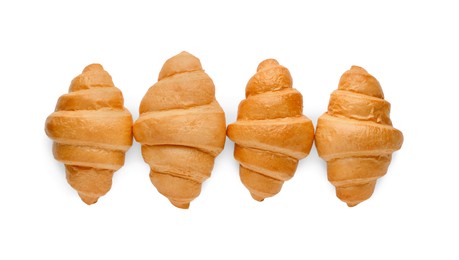 Delicious fresh croissants isolated on white, top view